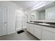 Modern bathroom with double vanity and walk-in shower at 102 Lake Tracy Ct, Haines City, FL 33844