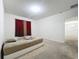Spacious bedroom with a full bed and access to another room at 102 Lake Tracy Ct, Haines City, FL 33844