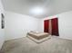 Simple bedroom with a full-size bed and neutral decor at 102 Lake Tracy Ct, Haines City, FL 33844