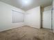 Simple bedroom with neutral walls and carpeted floor at 102 Lake Tracy Ct, Haines City, FL 33844