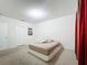 Well-lit bedroom with a full-size bed and neutral walls at 102 Lake Tracy Ct, Haines City, FL 33844