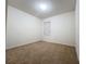 Empty bedroom with neutral walls and carpeted flooring at 102 Lake Tracy Ct, Haines City, FL 33844