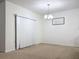 Bright dining room features a chandelier and sliding glass door at 102 Lake Tracy Ct, Haines City, FL 33844