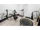 Home gym with treadmill, weight bench, and other exercise equipment at 102 Lake Tracy Ct, Haines City, FL 33844