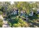 Aerial view of a house with a large yard and mature trees at 1109 Lakeshore Blvd, St Cloud, FL 34769