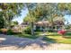 House exterior showcasing a brick walkway and lush landscaping at 1109 Lakeshore Blvd, St Cloud, FL 34769