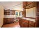 Cozy kitchen featuring wood cabinets and tile countertops at 1109 Lakeshore Blvd, St Cloud, FL 34769
