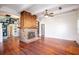 Spacious living room with hardwood floors and a brick fireplace at 1109 Lakeshore Blvd, St Cloud, FL 34769