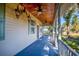 Inviting front porch with ceiling fans and ornate lighting at 1109 Lakeshore Blvd, St Cloud, FL 34769