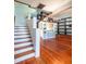 Open staircase leading to upper level with built-in shelving at 1109 Lakeshore Blvd, St Cloud, FL 34769