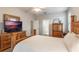 Spacious bedroom with a dresser and ensuite bathroom at 144 Costa Loop, Auburndale, FL 33823