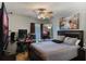 Spacious bedroom with large bed, TV, and workspace at 144 Costa Loop, Auburndale, FL 33823