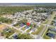 Home's location highlighted in a wide aerial neighborhood view at 1603 Tench Ct, Kissimmee, FL 34759