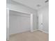 Spacious bedroom with a large closet and neutral color palette at 1603 Tench Ct, Kissimmee, FL 34759