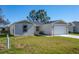 Newly built home with a two-car garage and well-maintained lawn at 1603 Tench Ct, Kissimmee, FL 34759