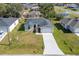 New construction home showcasing a two-car garage and driveway at 1603 Tench Ct, Kissimmee, FL 34759