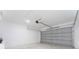 Attached garage with overhead door and ample space at 1603 Tench Ct, Kissimmee, FL 34759
