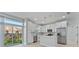 Modern kitchen features white cabinets, stainless steel appliances, and an island at 1603 Tench Ct, Kissimmee, FL 34759