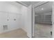 Laundry room with garage access and built-in shelving at 1603 Tench Ct, Kissimmee, FL 34759