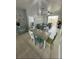 Dining area with a wood table and chairs, adjacent to living room at 2778 Almaton Loop # 303, Kissimmee, FL 34747