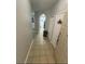 Tiled entryway with access to the living area and laundry at 2778 Almaton Loop # 303, Kissimmee, FL 34747