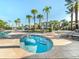 Relaxing hot tub surrounded by lounge chairs and palm trees at 2778 Almaton Loop # 303, Kissimmee, FL 34747