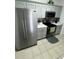 Modern kitchen with stainless steel appliances and gray cabinets at 2778 Almaton Loop # 303, Kissimmee, FL 34747