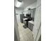 Modern kitchen with stainless steel appliances and gray cabinets at 2778 Almaton Loop # 303, Kissimmee, FL 34747