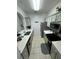 Modern kitchen with stainless steel appliances and gray cabinets at 2778 Almaton Loop # 303, Kissimmee, FL 34747