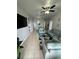 Spacious living room with light gray sofas and a large TV at 2778 Almaton Loop # 303, Kissimmee, FL 34747