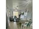 Open living area with gray sofas, dining table and access to balcony at 2778 Almaton Loop # 303, Kissimmee, FL 34747