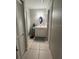 Clean bathroom with a vanity, tiled floors and a shower at 453 Hunter Circle, Kissimmee, FL 34758