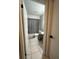 Bathroom with bathtub, toilet and gray shower curtain at 453 Hunter Circle, Kissimmee, FL 34758
