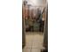 Well-organized closet with clothing and storage bins at 453 Hunter Circle, Kissimmee, FL 34758