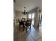 Dining area with a table and chairs, featuring access to the patio at 453 Hunter Circle, Kissimmee, FL 34758