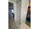 Hallway with linen closet and view into bedroom at 453 Hunter Circle, Kissimmee, FL 34758