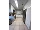 Modern kitchen with stainless steel appliances and white cabinetry at 453 Hunter Circle, Kissimmee, FL 34758