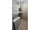 Small laundry room with a stacked washer and dryer at 453 Hunter Circle, Kissimmee, FL 34758