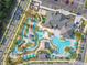 Aerial view of community pool, water park, and clubhouse at 4741 Clock Tower Dr # 205, Kissimmee, FL 34746