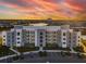 Modern apartment building with lake view and parking at 4741 Clock Tower Dr # 205, Kissimmee, FL 34746