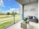 Private balcony with seating area and view at 4741 Clock Tower Dr # 205, Kissimmee, FL 34746