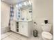 Double vanity bathroom with soaking tub and shower at 4741 Clock Tower Dr # 205, Kissimmee, FL 34746