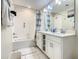 Bathroom with double vanity and shower/tub combo at 4741 Clock Tower Dr # 205, Kissimmee, FL 34746