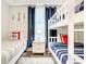 Bedroom with twin bed and bunk bed, nautical theme at 4741 Clock Tower Dr # 205, Kissimmee, FL 34746