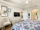 Serene bedroom with a king bed, dresser, and access to the bathroom at 4741 Clock Tower Dr # 205, Kissimmee, FL 34746