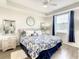 Spacious Primary bedroom with a king-size bed and plenty of natural light at 4741 Clock Tower Dr # 205, Kissimmee, FL 34746