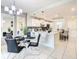 Modern kitchen with white cabinets, large island, and stainless steel appliances at 4741 Clock Tower Dr # 205, Kissimmee, FL 34746
