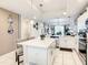 Modern kitchen with white cabinets and kitchen island at 4741 Clock Tower Dr # 205, Kissimmee, FL 34746
