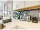 Compact kitchen area with toaster and coffee maker at 4741 Clock Tower Dr # 205, Kissimmee, FL 34746