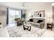 Relaxing living room featuring a comfy sofa and sliding doors at 4741 Clock Tower Dr # 205, Kissimmee, FL 34746